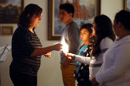Arkansas immigrants and others light candles during a vigil April 10 at Immaculate Conception Church in Fort Smith. Seven other cities hosted vigils to demonstrate Arkansas’ commitment to immigration reform. Karen Schwarz photo
