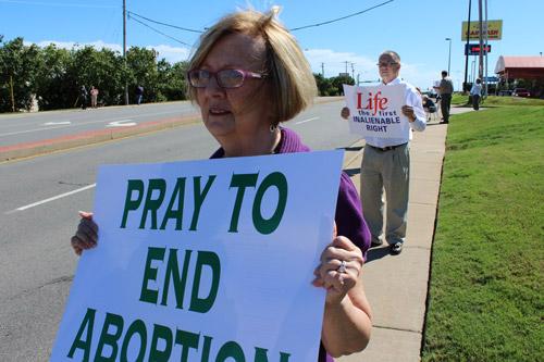 Margaret Zakrzewski and her husband Frank offer prayers for the unborn during the Life Chain. They attend Our Lady of Good Counsel in Little Rock. Dwain Hebda photo