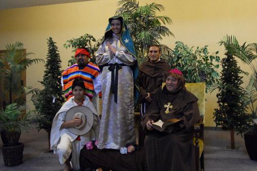 Members of St. Stephen Church in Bentonville re-enact the vision of Our Lady of Guadalupe to St. Juan Diego at a recent performance of the play.