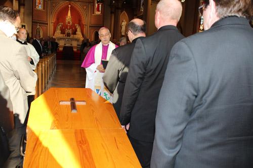 Bishop Anthony B. Taylor meets the coffin and pallbearers at the doors of Cathedral of St. Andrew in Little Rock prior to the April 7 vigil. Dwain Hebda photo