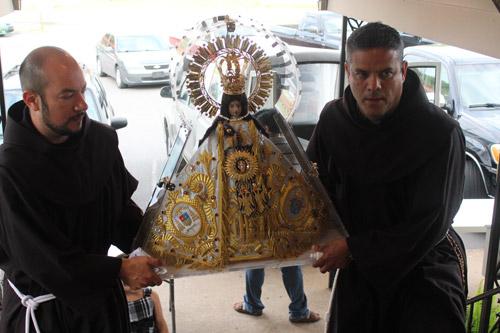 Our Lady of Zapopan traveling statue arrives at St. Anne Church in North Little Rock July 27. Three Franciscan friars accompanied the statue from Jalisco, Mexico. Dwain Hebda photo