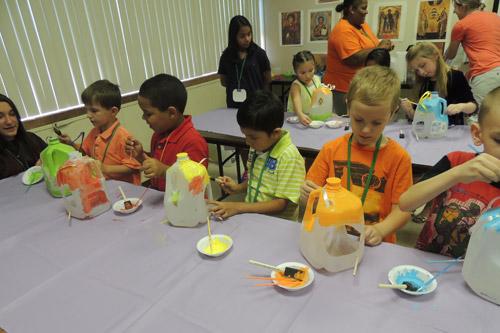 Vacation Bible school children complete craft projects during Summer Celebration in Texarkana. The event is sponsored by St. Edward Church on the Arkansas side of town and Sacred Heart Church on the Texas side. John Debenport photo
