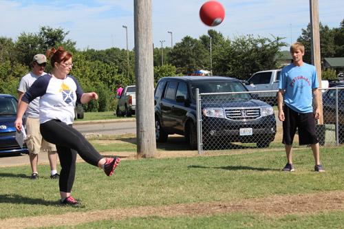 North Little Rock’s Kimberly Bosshart launches one during a Novice Division match. She said kickball strengthens bonds between parishioners and, “shows church people can be fun, too.” Dwain Hebda photo