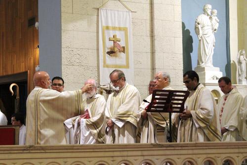 Deacon Norman McFall censes the priests in attendance at his Ordination to the Diaconate at St. Joseph Church in Pine Bluff. McFall is set to join their ranks with his priestly ordination in 2016. (Dwain Hebda photo) 