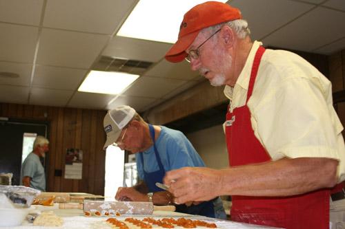 Tommy Strabala and Connie Chudy (back left) prepare their apricot kolaches. (Aprille Hanson photo)  