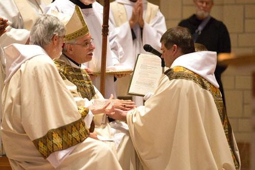 Bishop Anthony B. Taylor anoints the hands of Father Patrick Boland, OSB, during his ordination to the priesthood June 20 at Subiaco Abbey. (Karen Schwartz photo)