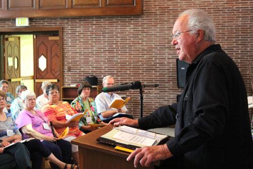 Msgr. Richard Oswald of Little Rock, former director of the Little Rock Scripture Study, conducts morning prayer June 20. The theme for the 2015 Bible Institute was “The Jesus of the Gospels.” (Dwain Hebda photo)