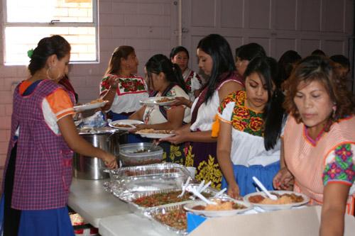 After Mass, people gathered at the Hestand Stadium Fairgrounds to eat pork, rice and pico de gallo, listen to music and dance. (Aprille Hanson photo)