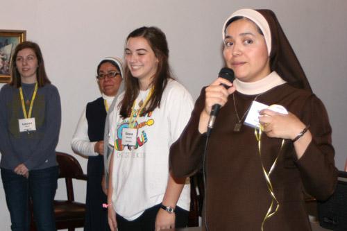 Sister Rosy Perez, CMST, from St. Joseph Church in Conway, explains an ice breaker game. From left: Lauren Morris, St. Stephen Church in Bentonville; Sister Silvia Dominquez, MCP; and Grace Ridgeway, Christ the King Church in Little Rock. (Aprille Hanson photo)
