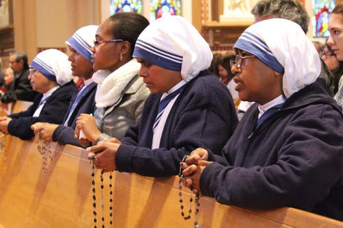 Missionaries of Charity, Calcutta (MCC) sisters pray the rosary prior to the start of the annual Mass for Life, celebrated at Cathedral of St. Andrew in Lit-tle Rock. (Dwain Hebda photo)