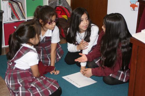 Each student group was asked to discuss a plan on how to build their tower before the gumdrops and toothpicks were passed out. Pictured are: Valeria Perez, second grade (left); Amelia Ramirez, second grade; Madison Barrera, third grade; and Karen Sekely, fourth grade. (Aprille Hanson photo)