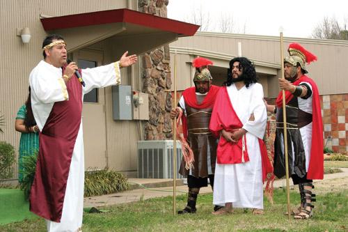 Vincentian missionaries perform the Stations of the Cross on the grounds of St. James Church in Searcy. Carlos Flores portrays Pontius Pilate and Juan Chavez portrays Jesus. (Prints not available.)