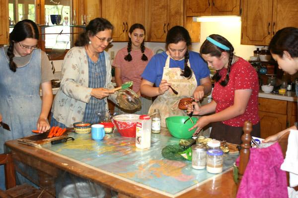 The Crimmins family all pitches in to make a meat-free Friday lunch April 13. From left are Mary, 17; mother Lucrecia; Sophia, 15; Abigail, 21; Elizabeth, 10; and Emilie, 19. (Malea Hargett photo)