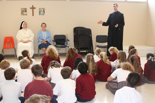 Brother Raban Heyer, OSB, talks to students from Christ the King School in Little Rock. (Malea Hargett photo)