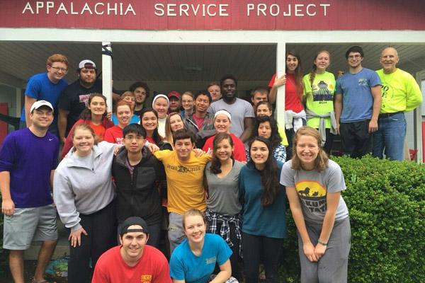 About 30 Catholic college students and chaperones traveled to Chavies, Ky., to volunteer through the Appalachia Service Project May 15-21. Pictured, back row: Casey Self (left), Cristian Robles, Grace Johnson, Sam Johnson, Sister Mary Clare Bezner, Brandon Weisenfels, Vianca Martin, Elijah Muldar, Nick Baltz, Anthony Bassey, Chance Keith, Katie Karp, Caitlyn Bartol, Blake Marshall and Deacon Richard Papini; middle row: Adam Koehler (left), Lauren Widmer, Clare Doss, Meghan McCabe, Loren Bennett, Alexa Gates, Mary Chavex and Holly Hambuchen; front row: Morgan Burke (left), Joseph Pham, Nicholas Wolpert, Jessi Balagatas and Victoria Loredo; ASP staff includes Annie, Max and Jordan. 