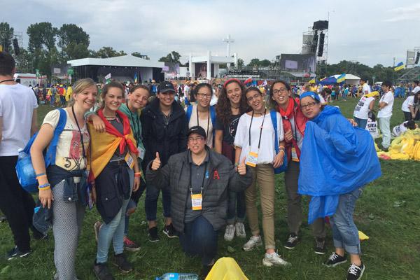 Brenda Martinez of St. Edward Church in Little Rock (fourth from left), Karina Silva of Oklahoma (far right) and Rocio Montes (center) with the diocesan Hispanic Ministry Office pose with Spanish pilgrims at World Youth Day in Poland. (Courtesy Rocío Montes)