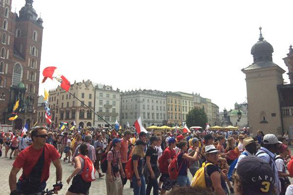 World Youth Day pilgrims soak up Kraków’s Market Square, where many visited St. Mary’s Basilica and the Cloth Hall (Courtesy Laredo Loyd). 