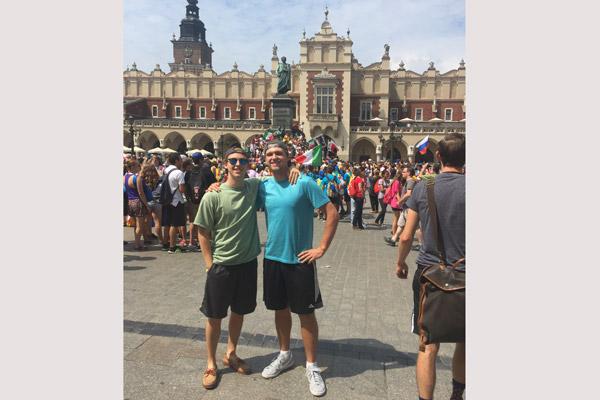 Laredo Loyd, of St. Bartholomew and St. Theresa churches in Little Rock (right), stands with friend Martin Ptak in front of Kraków’s Cloth Hall during World Youth Day. (Courtesy Laredo Loyd)