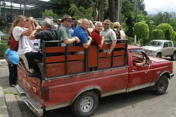 Bishop Taylor and other pilgrims travel in the back of a pick up while visiting Guatemala.  