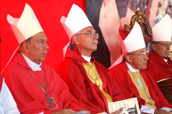 Bishop Taylor (center) sits with Oklahoma City Archbishop emeritus Eusebius J. Beltran (right) and other bishops during Mass July 28. 