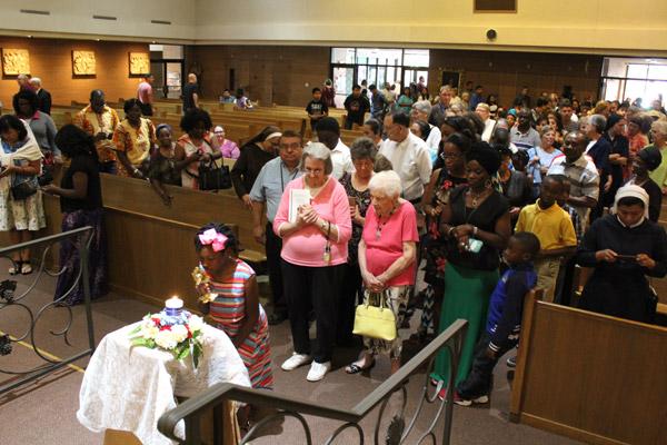 Congregants wait in line to venerate the relics of St. Teresa of Kolkata following her feast day Mass at Our Lady of Good Counsel. More than 350 congregants attended the Little Rock event. (Dwain Hebda photo)