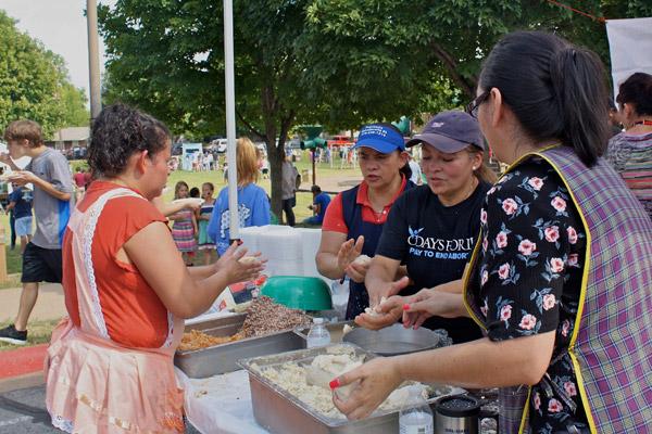 Kety Guerra (from left), Aida Berganza, Marta Orrellana and Yanria Pleitez help prepare a favorite Salvadoran food, pupusas, for the annual St. Vincent de Paul parish festival held Sunday, Sept. 24. (Alesia Schaefer photo)