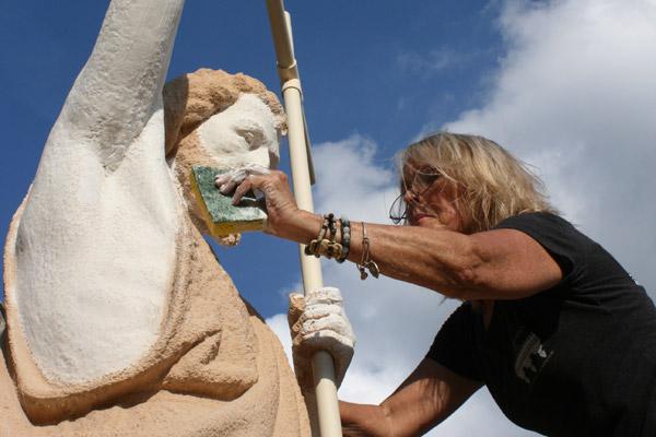 On most of the statues, including John the Baptist, Michele Bowman added two coats of primer, two coats of finishing paint and two coats of all-weather sealant to protect the statues from future damage. (Aprille Hanson photo)