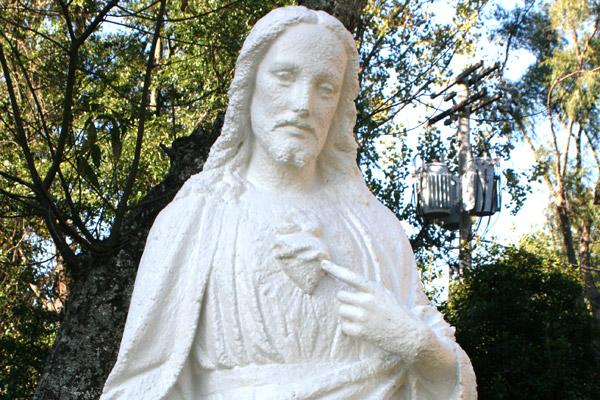 The Sacred Heart of Jesus statue was primed, painted and sealed after Michele Bowman saw it and agreed to repair it at no additional charge after she arrived on campus. (Aprille Hanson photo)