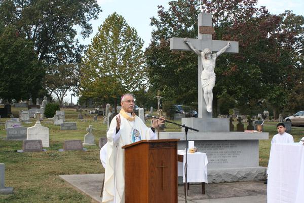 Bishop Anthony B. Taylor delivers his homily during the annual All Souls Day Mass at Calvary Cemetery on Nov. 2 to a crowd of about 50 people. (Aprille Hanson photo)