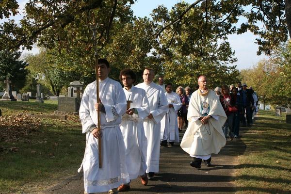 Seminarian Omar Galván (left) and discerner John Marconi help lead the rosary procession with Deacon Chuck Ashburn, assistant director for development and academic advising in the Office of Vocations and Seminarians in the Diocese of Little Rock, and Bishop Taylor. (Aprille Hanson photo)