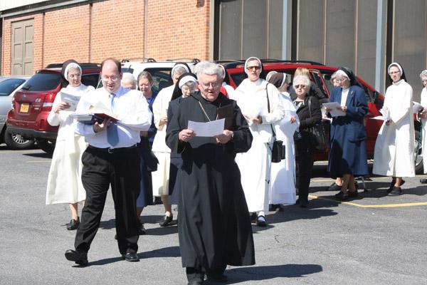 Abbot Leonard Wangler, OSB, of Subiaco Abbey leads 50 religious women and men March 5 from the church gymnasium to the Door of Mercy at Our Lady of Good Counsel Church in Little Rock. (Malea Hargett / Arkansas Catholic file)