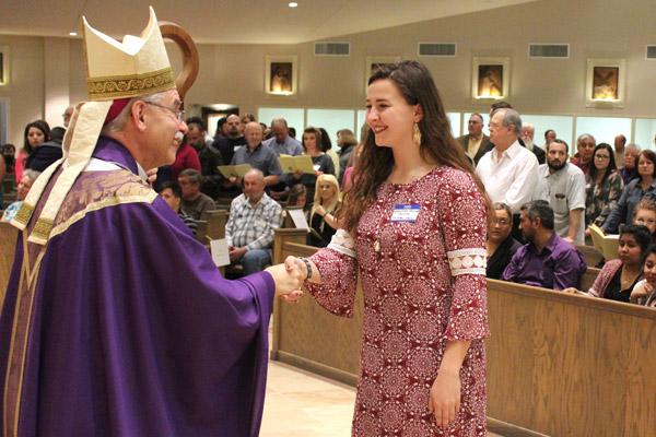 Vanessa Shields beams as she is greeted by Bishop Taylor March 5. Shields is a candidate from St. James Church in Searcy. (Dwain Hebda photo)
