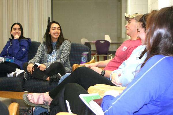 Students at the University of Central Arkansas in Conway laugh and share stories during a Bible study in Baridon Hall dormitory March 2. Junior Jocelyn Leyva (second from left), 20, said it’s her first time leading a Bible study group. (Aprille Hanson photo)