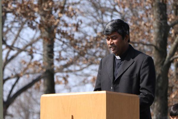 Pastor Father Alphonse Gollapalli speaks during Blessed Sacrament's groundbreaking ceremony for its new church. He said it is a day parishioners have been waiting for. (Sarah Morris photo)
