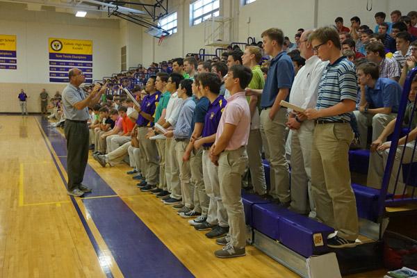 The Schola Choral Group sings after Principal Steve Straessle welcomed everyone to Aubrey Volpert’s signing day May 9 at Catholic High School for Boys in Little Rock. (Aprille Hanson photo)