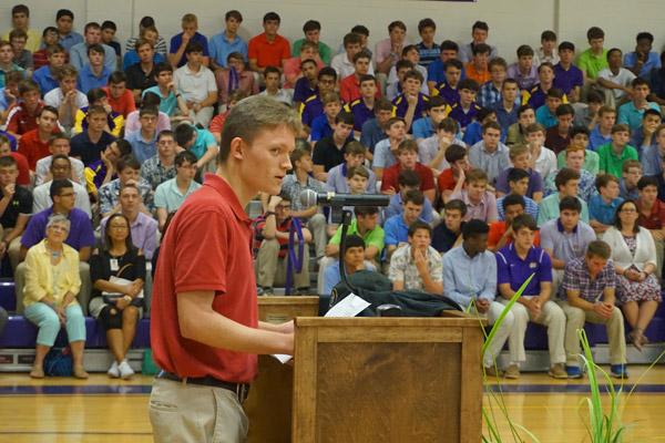 Aubrey Volpert speaks to fellow Catholic High classmates May 9 about his decision to join the seminary and become a priest. (Aprille Hanson photo)