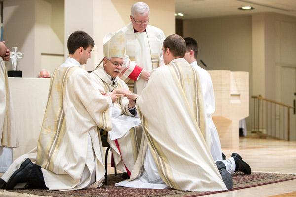 Bishop Anthony B. Taylor anoints the hands of Father Martin Siebold during his ordination. (Travis McAfee photo)