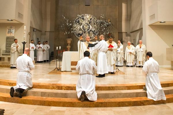 During the prayer of ordination Bishop Taylor asks God to send forth the Holy Spirit on the new deacons. (Bob Ocken photo)