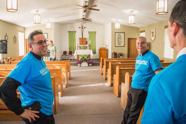 Father Marquez-Munoz, Bishop Taylor and Dr. Muldoon of Extension Society tour Blessed Stanley Rother Mission following the Mass and dinner. The former Baptist church was too small to host the Sept. 24 Mass. (Travis McAfee photo)
