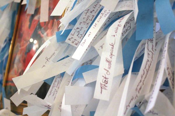 Prayer intentions written on ribbons crowd the prayer frames as part of the Mary Undoer of Knots Prayer Project. (Dwain Hebda photo)