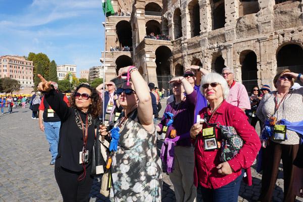 A Roman tour guide points to other arches still standing around the Flavian Amphitheater, better known as the Colosseum, Nov. 2. Listening are Robyn Bradley of North Little Rock, Alice Nahas of Paris, Rena Harrison of Pine Bluff and Barbara Menz Bryan of Texas. (Malea Hargett photo)