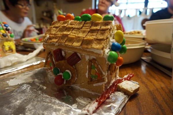 CJ Fausett, 12, of Mayflower, said she enjoyed coming over to make the Christmas cookie houses for the first time. She added a reindeer design to her house. (Aprille Hanson photo)