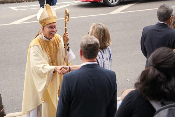 Parishioners greet Bishop Taylor after Mass at the Cathedral of St. Andrew. (Malea Hargett)