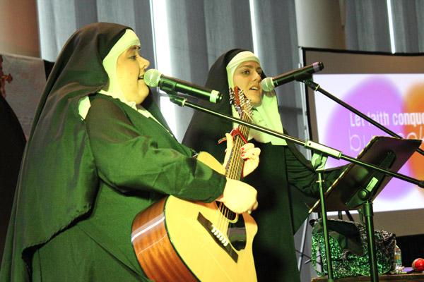 Nun and Nunner, aka Sister Mary Rose (left) and Sister Maria Stella provide lively music and humor with a message for teens from across Arkansas at the 2018 Catholic Youth Convention in Little Rock. (Dwain Hebda photo)