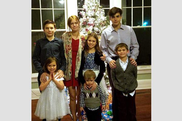 The seven younger Caruthers children of Fort Smith stand for their annual Christmas portrait. They are (back row from left), Jack, 14; Amelia, 19; Ellie, 11; and Joseph, 17. Front row from left are Bridget, 6; Ben, 3; and Eli, 9. Not pictured is Annalie, 21.