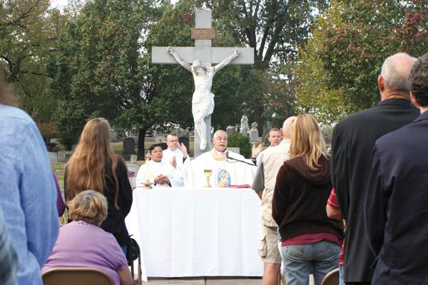 Bishop Taylor concelebrates the annual All Souls Day Mass at Calvary Cemetery Nov. 2, 2016 with about 50 of the faithful. (Aprille Hanson / Arkansas Catholic file)