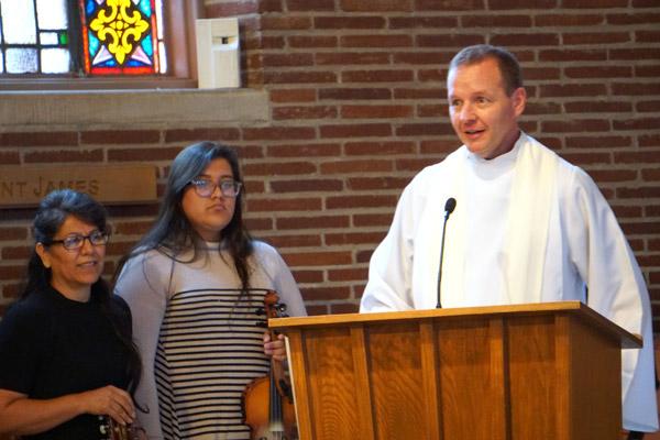 Father Erik Pohlmeier, diaconate formation director, speaks to the deacon candidates and their wives at the conclusion of Mass. (Malea Hargett photo)