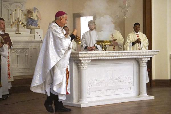 Bishop Taylor incenses the altar and church, following the Rite of Dedication of a Church and an Altar at Blessed Sacrament Church. (Aprille Hanson photo) 