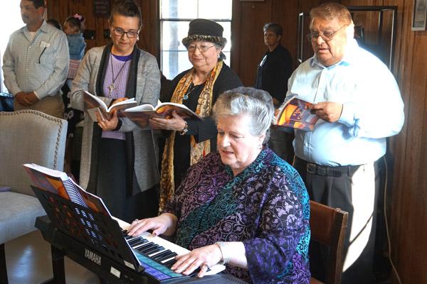 Choir members provide music for the March 16 bilingual Mass that officially established the St. Oscar Romero Catholic Community of Greenbrier. (Aprille Hanson photo)