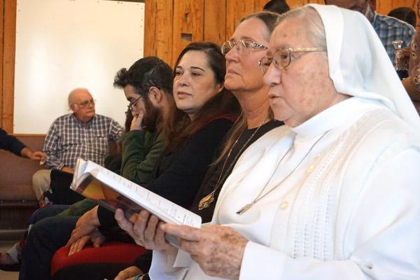 Sister Ana Brígida Riveros sings during Mass at St. Oscar Romero Catholic Community in Greenbrier along with the rest of the congregation. The sisters will minister to the community as they do at St. Joseph Church in Conway. (Aprille Hanson photo)